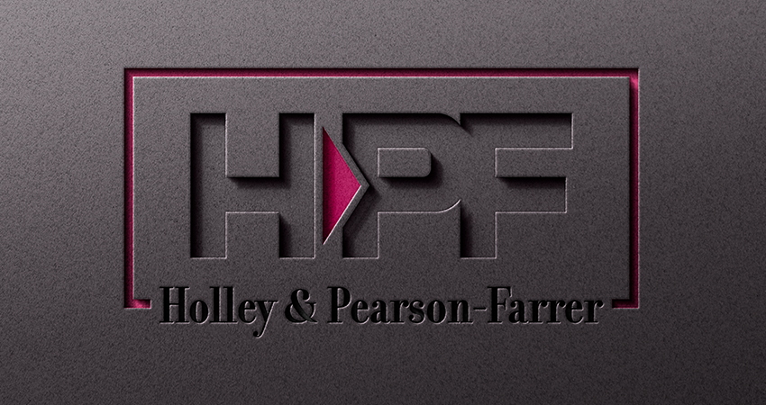 Logo mock up of the Holly-Pearson & Ferrer on the wall sign